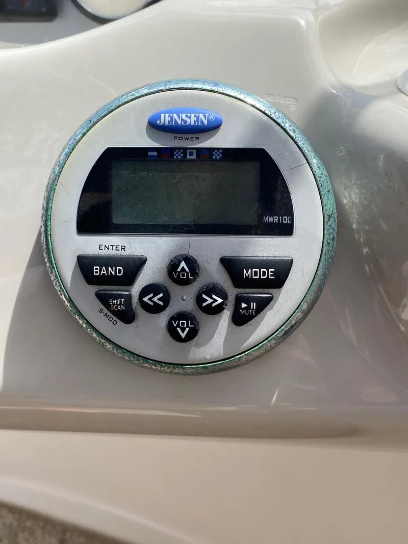 Slide: The Image of Jensen marine stereo control on 2008 Glastron 175 MX boat dashboard. - 9