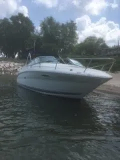 Slide: The Image of 2007 Sea Ray 215 Weekender boat docked near a sandy shore. - 5