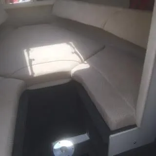 Slide: The Image of Interior cabin of a 2007 Sea Ray 215 Weekender boat with beige seating. - 6