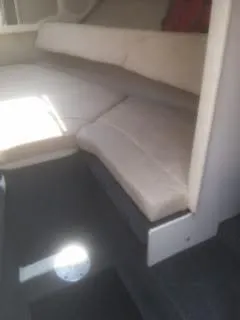 Slide: The Image of Interior cabin of 2007 Sea Ray 215 Weekender boat with beige seating. - 8