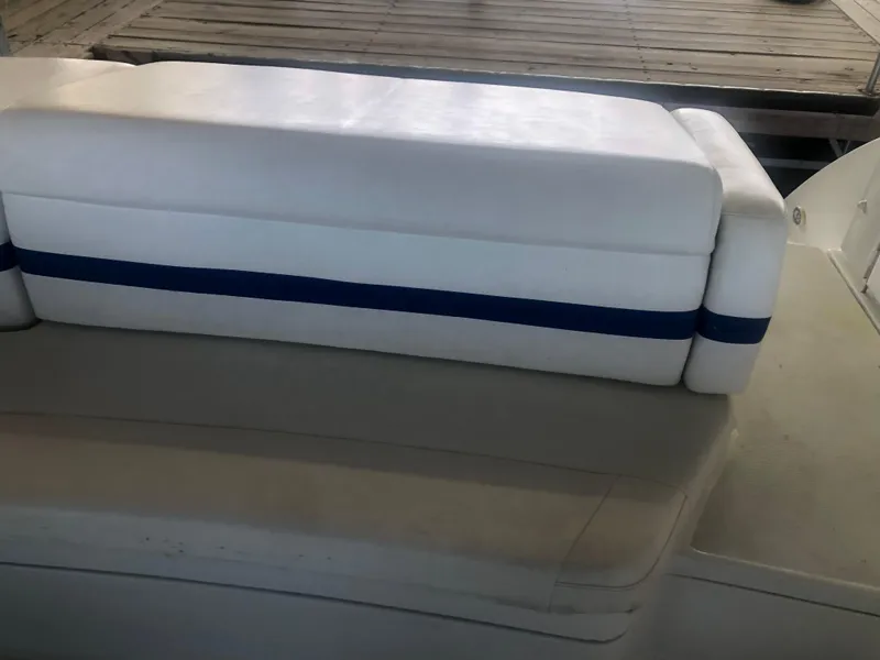 Slide: The Image of 2004 Formula 330 Sun Sport boat interior with white and blue seating. - 17