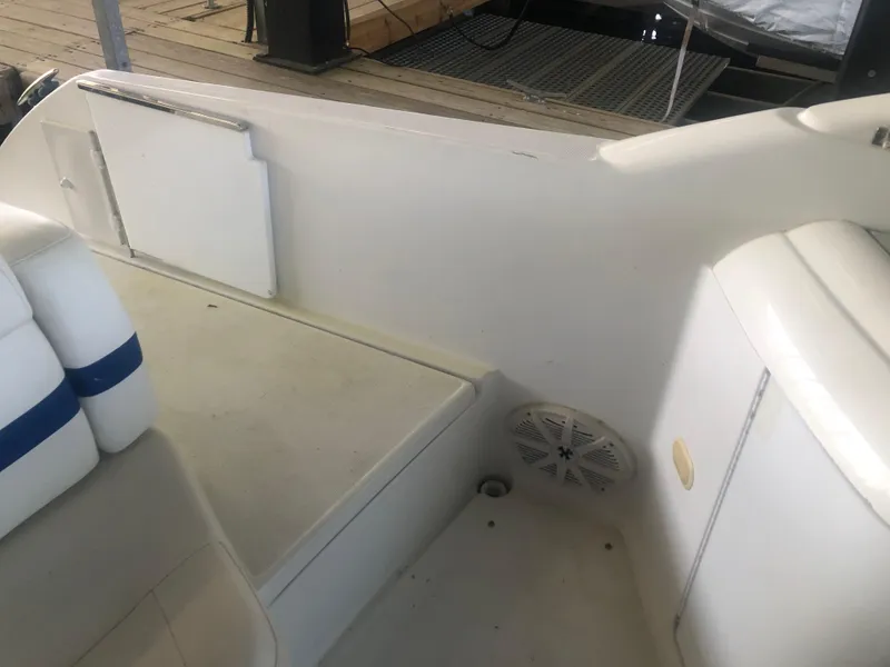 Slide: The Image of White cushioned seating on a 2004 Formula 330 Sun Sport boat. - 18