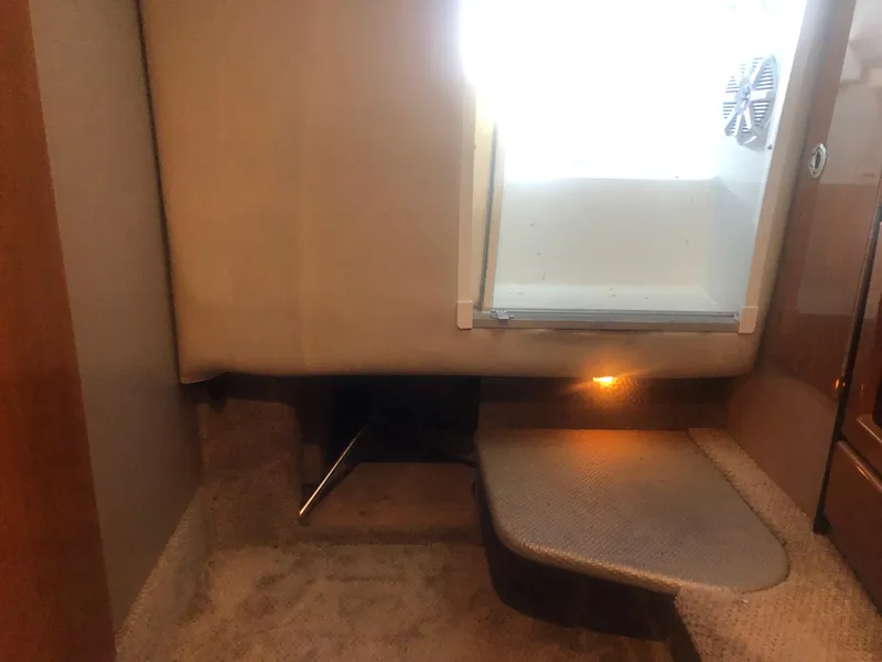 Slide: The Image of 2004 Formula 330 Sun Sport boat bathroom with sink, toilet, and curtain. - 31