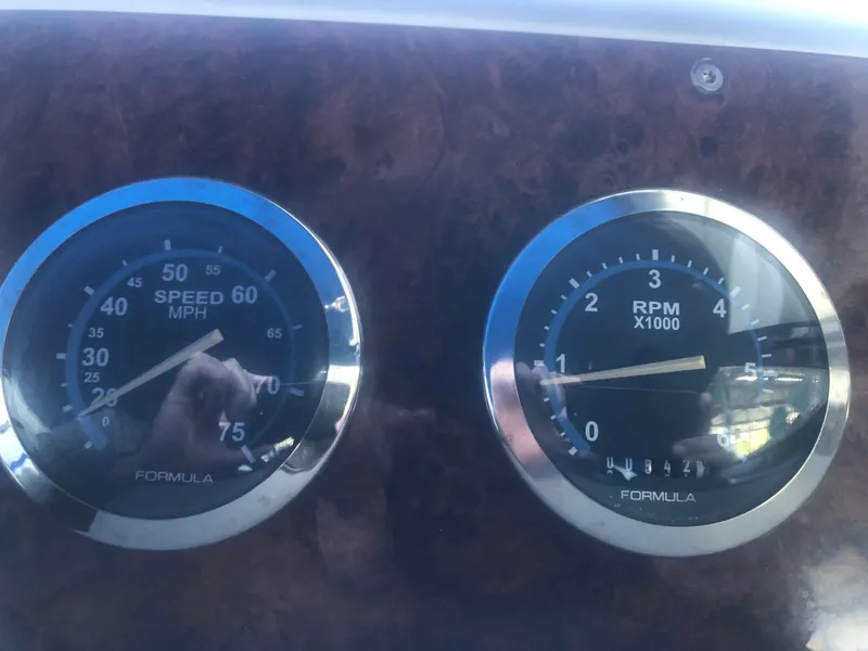 Slide: The Image of Interior of a 2004 Formula 330 Sun Sport boat with control panel and lighting. - 34