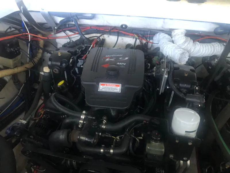 Slide: The Image of Engine of a 2004 Formula 330 Sun Sport boat, showcasing detailed components. - 37