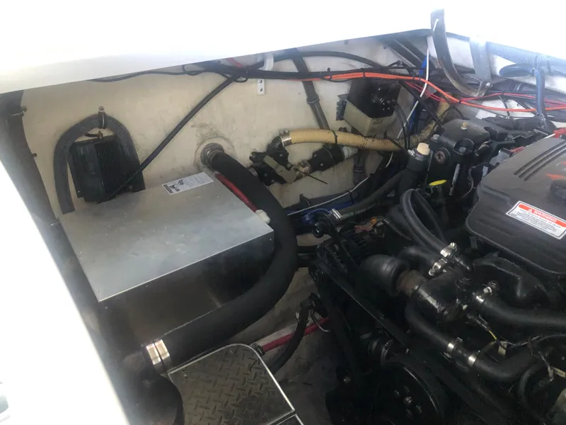 Slide: The Image of Engine compartment of a 2004 Formula 330 Sun Sport with visible batteries and wiring. - 42