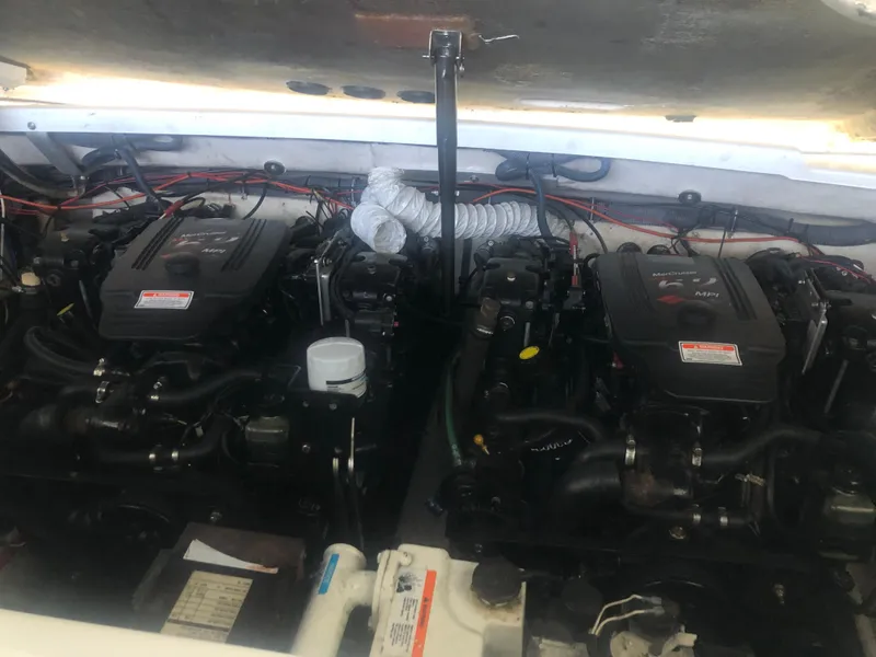 Slide: The Image of 2004 Formula 330 Sun Sport engine compartment with dual engines and wiring. - 44