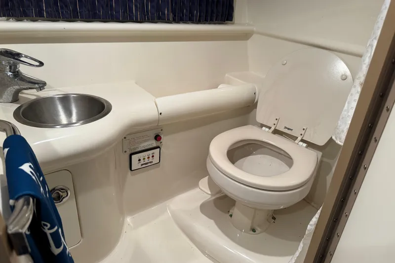 Slide: The Image of 2004 Formula 330 Sun Sport boat bathroom with sink and toilet. - 51