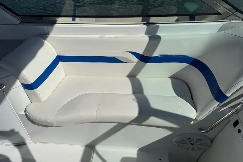 Slide: The Image of 2004 Formula 330 Sun Sport boat interior with white and blue seating. - 58