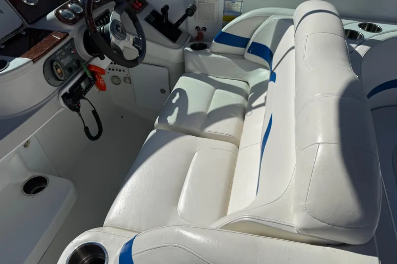 Slide: The Image of 2004 Formula 330 Sun Sport boat interior with white and blue seating. - 61