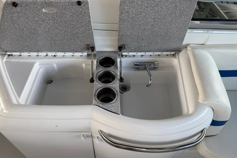 Slide: The Image of 2004 Formula 330 Sun Sport boat sink with cup holders and faucet. - 72