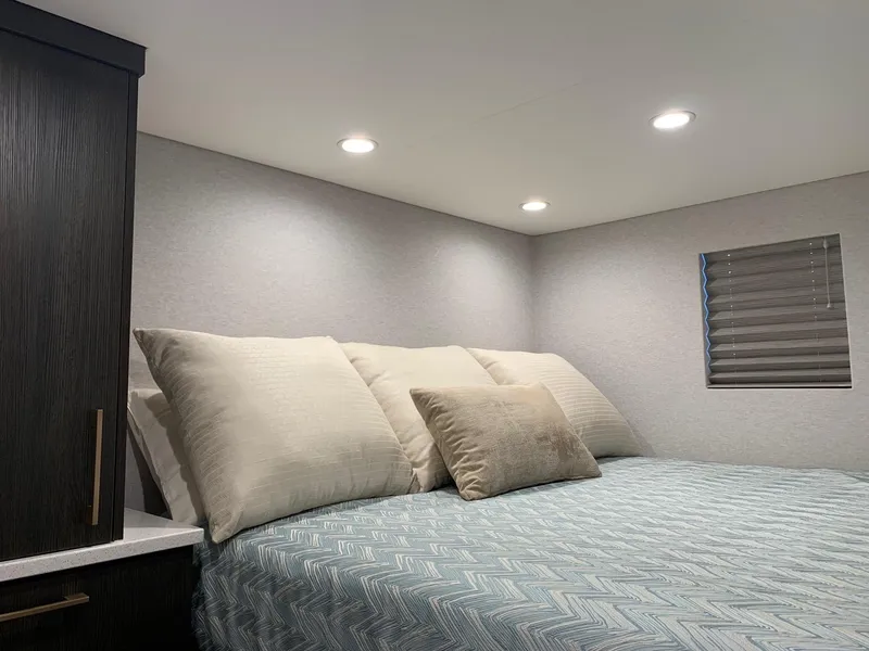 Slide: The Image of Cozy bedroom interior in 2019 Adonia Athena RV with modern lighting and comfortable bedding. - 6