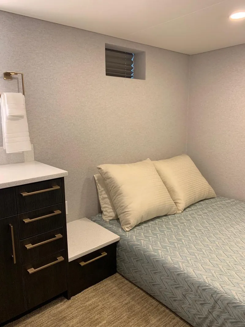 Slide: The Image of Cozy bedroom in 2019 Adonia Athena, featuring a bed and modern cabinetry. - 8