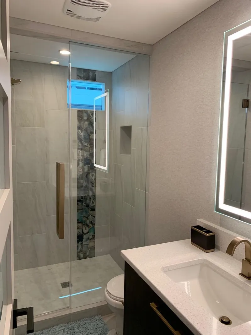 Slide: The Image of Modern bathroom with glass shower, illuminated mirror, and sleek fixtures, Adonia Athena model 2019. - 9