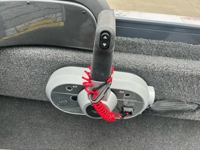 Slide: The Image of Control panel of 2024 Crestliner HAWK 1650 boat with throttle and safety lanyard. - 12