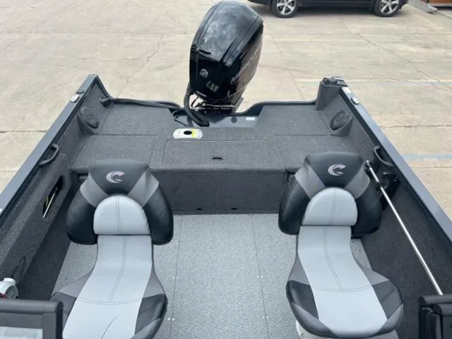 Slide: The Image of 2024 Crestliner HAWK 1650 boat interior with two seats and outboard motor. - 16