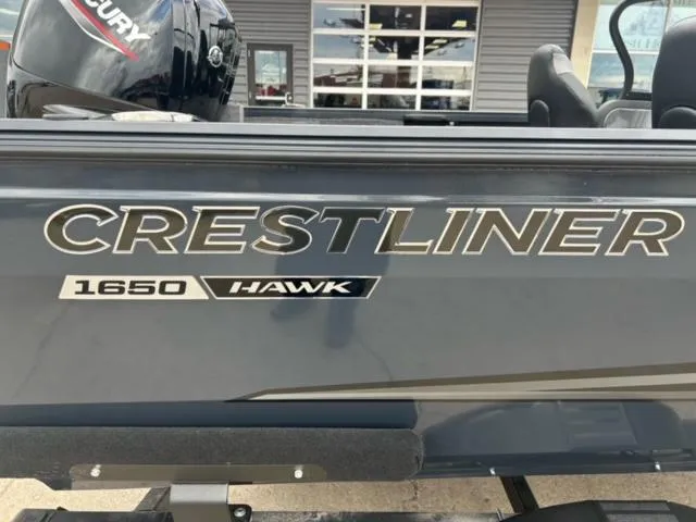 Slide: The Image of 2024 Crestliner HAWK 1650 boat side view with logo and model name. - 3