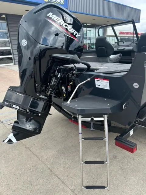 Slide: The Image of 2024 Crestliner HAWK 1650 boat with Mercury outboard motor and boarding ladder. - 4