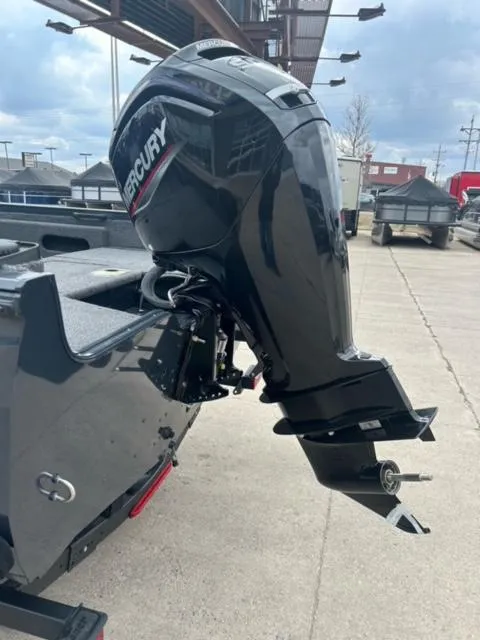 Slide: The Image of 2024 Crestliner HAWK 1650 with Mercury outboard motor on a concrete surface. - 5
