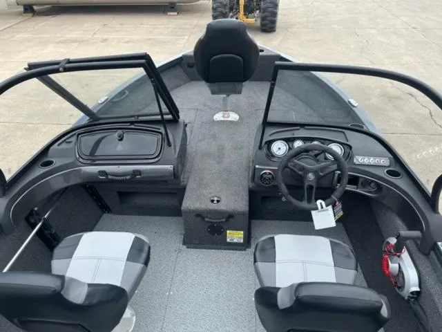 Slide: The Image of 2024 Crestliner HAWK 1650 boat interior with dual seats and steering console. - 8