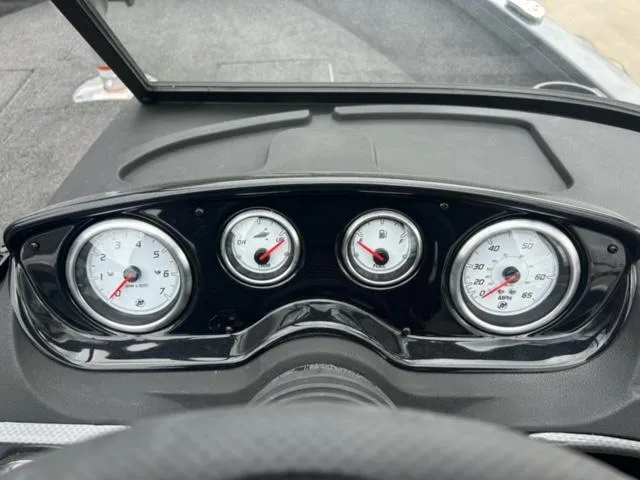 Slide: The Image of 2024 Crestliner HAWK 1650 dashboard with gauges and controls. - 9