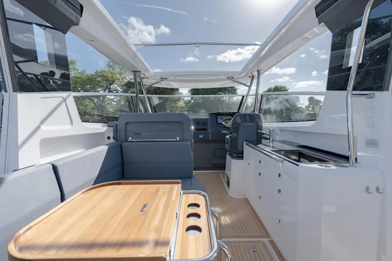 Slide: The Image of Interior of 2024 Nimbus Weekender 11 #20 boat with seating and helm station. - 10