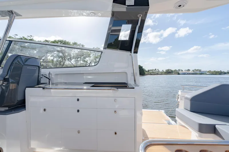 Slide: The Image of Modern outdoor kitchen on 2024 Nimbus Weekender 11 #20 yacht, with scenic water view. - 12