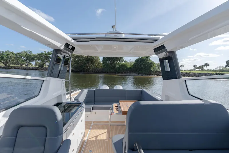 Slide: The Image of Interior view of 2024 Nimbus Weekender 11 #20 boat with seating and table. - 15