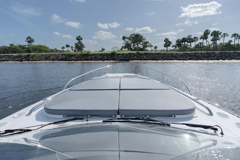 Slide: The Image of 2024 Nimbus Weekender 11 #20 boat on calm water with scenic shoreline. - 5