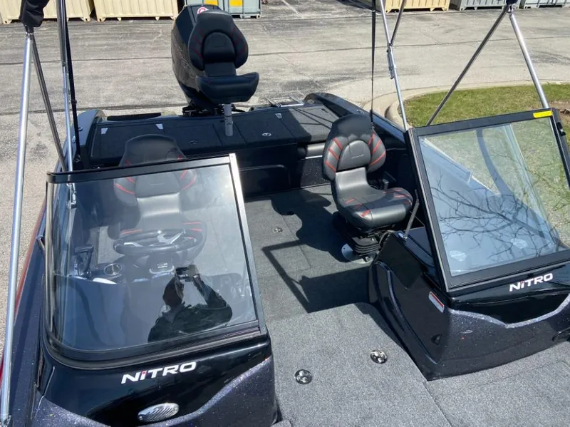 Slide: The Image of 2024 Nitro ZV19 Sport Pro boat interior with seating and windshields. - 5