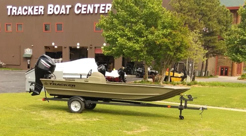 Slide: The Image of 2024 Tracker Grizzly 1648 SC boat on trailer outside Tracker Boat Center. - 5