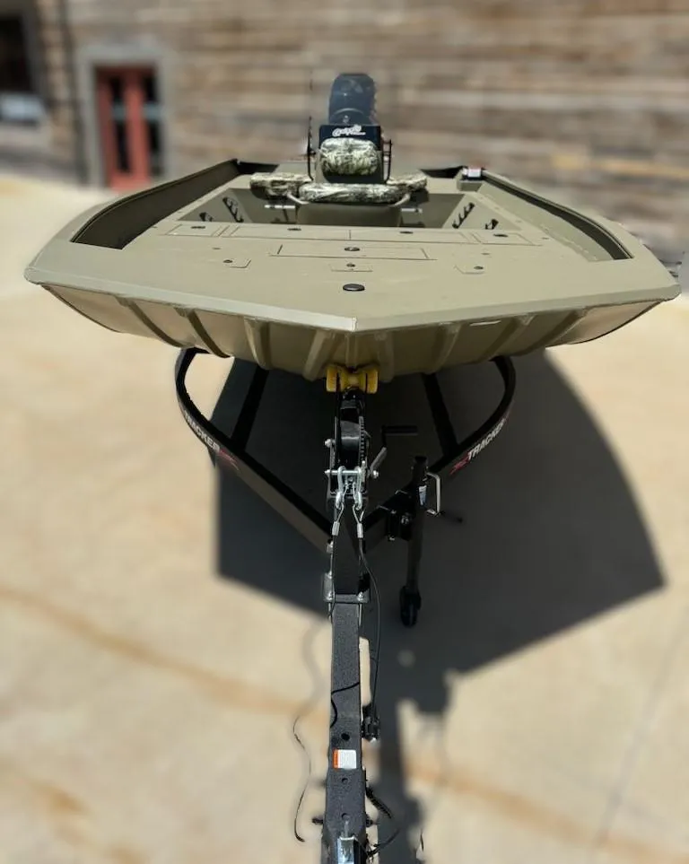 Slide: The Image of 2024 Tracker Grizzly 2072 CC boat on a trailer, front view. - 2