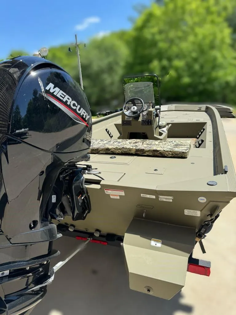 Slide: The Image of 2024 Tracker Grizzly 2072 CC boat with Mercury outboard motor. - 3