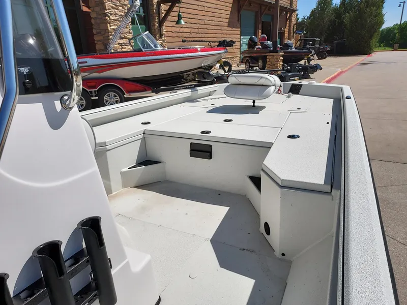 Slide: The Image of 2024 Ranger RB210 boat interior with seating and storage compartments. - 3