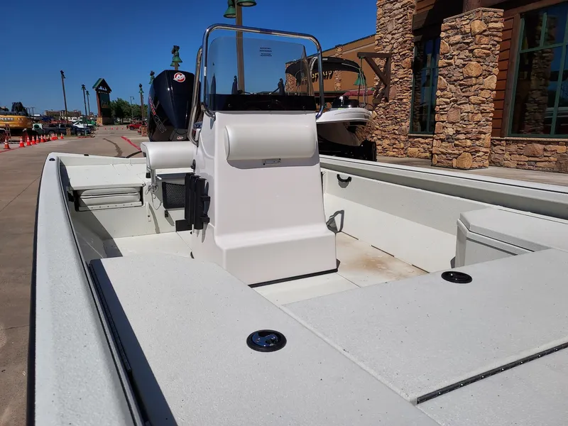 Slide: The Image of 2024 Ranger RB210 boat with center console, displayed outdoors near a stone building. - 4