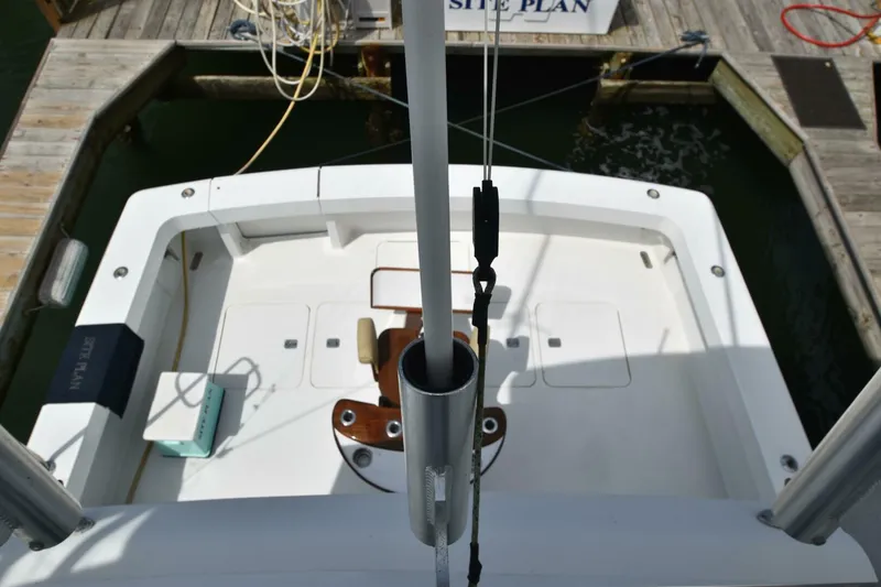 Slide: The Image of 2000 Viking 55 Convertible yacht docked, view of cockpit area with fishing chair. - 32