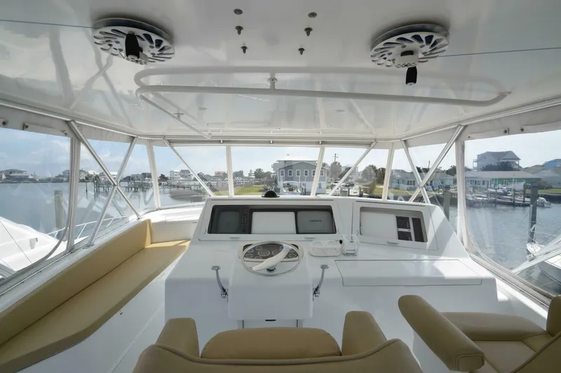 Slide: The Image of Interior view of 2000 Viking 55 Convertible yacht helm with panoramic windows. - 33