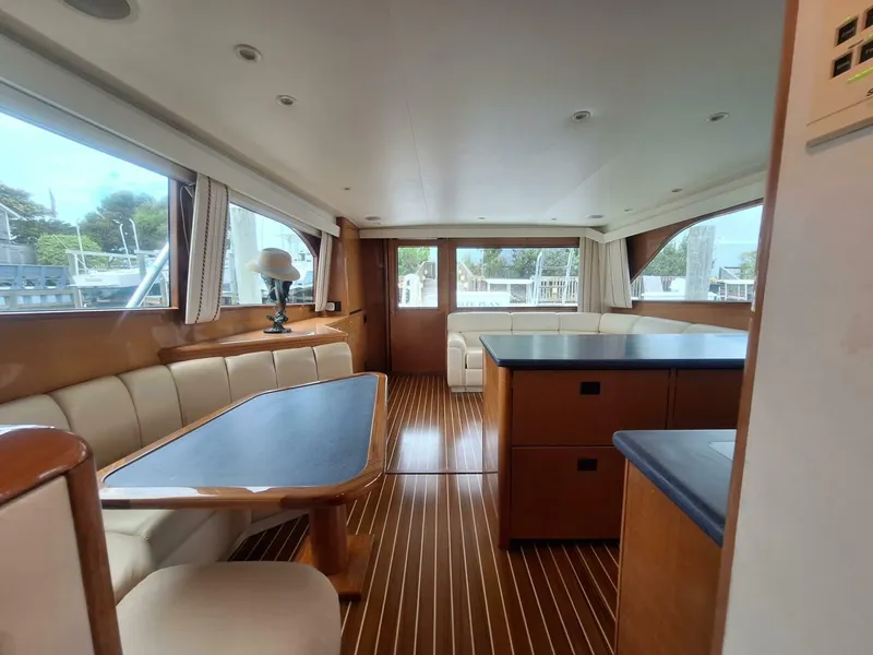 Slide: The Image of Luxurious interior of 2000 Viking 55 Convertible yacht with elegant wood finishes. - 45