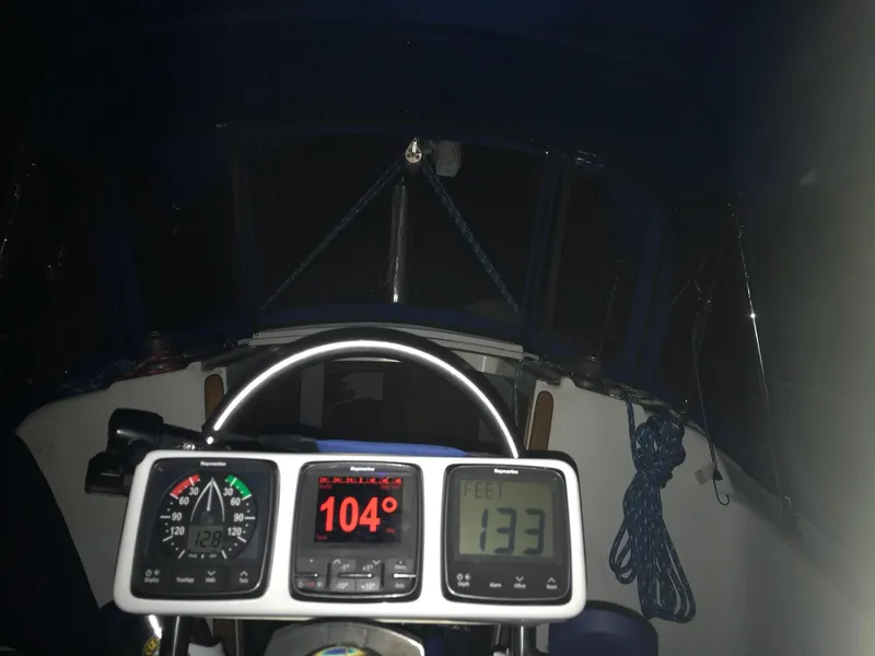 Slide: The Image of Cockpit of 1983 Hunter 27 sailboat with navigation instruments at night. - 12