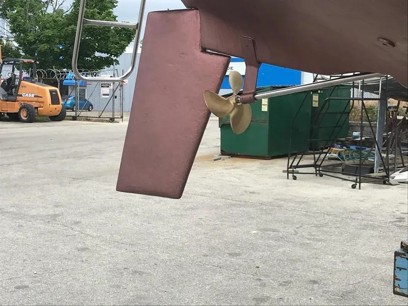 Slide: The Image of Hunter 27 sailboat (1983) rudder and propeller in a boatyard. - 18