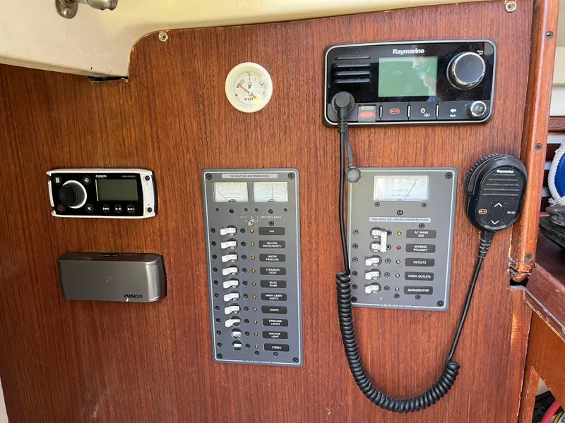 Slide: The Image of Control panel of a 1983 Hunter 27 sailboat with navigation and communication equipment. - 25