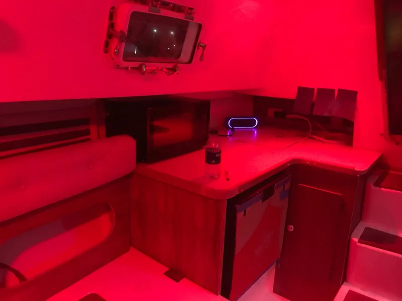 Slide: The Image of Interior of 1983 Hunter 27 sailboat with wooden finishes and cozy cabin. - 28