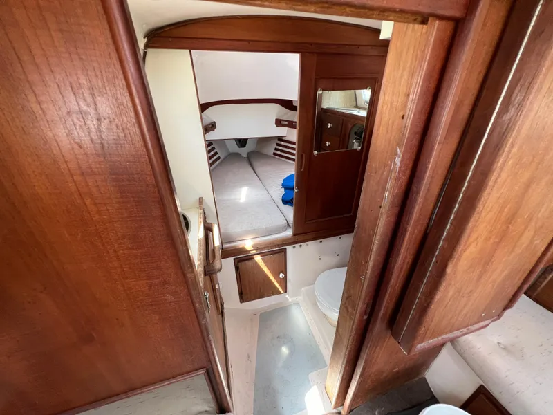 Slide: The Image of Interior of 1983 Hunter 27 sailboat with bed, sink, and toilet. - 29