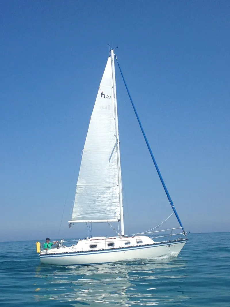 Slide: The Image of Red engine of a 1983 Hunter 27 sailboat in the engine compartment. - 37