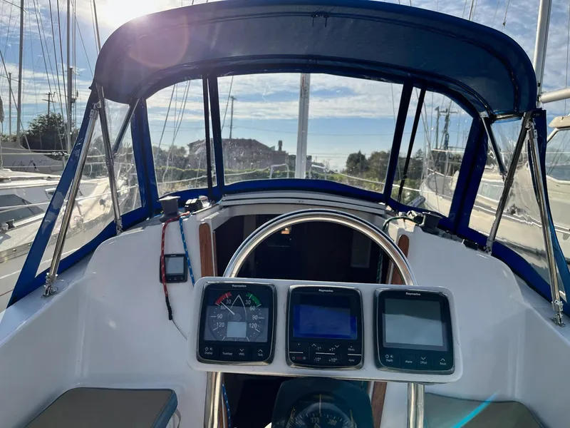 Slide: The Image of Cockpit view of a 1983 Hunter 27 sailboat with navigation instruments. - 9