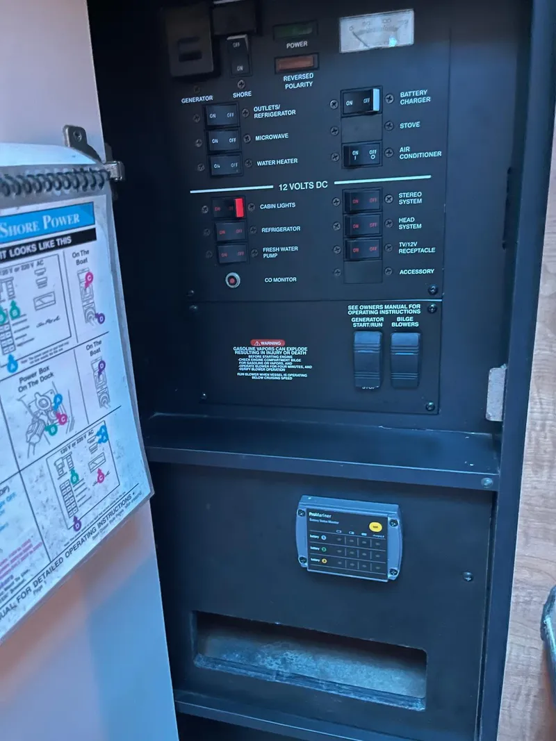 Slide: The Image of Electrical control panel on a 2006 Sea Ray 270 Amberjack boat. - 13