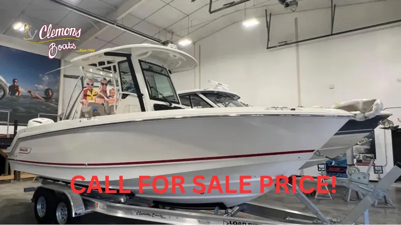 The Image of 2025 Boston Whaler 250 Outrage boat on trailer in showroom, call for sale price. - 0