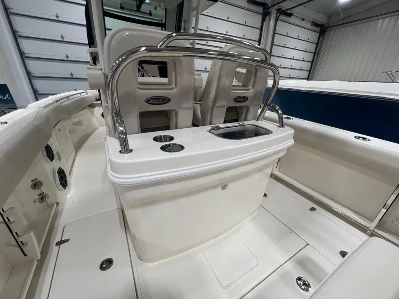 Slide: The Image of 2025 Boston Whaler 250 Outrage boat interior with seating and console. - 10