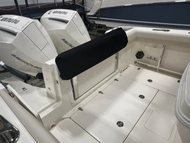 Slide: The Image of 2025 Boston Whaler 250 Outrage boat interior with twin Mercury engines. - 4