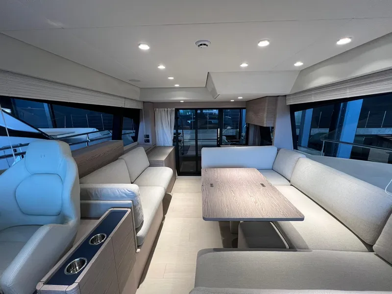 Slide: The Image of Luxurious interior of 2024 Ferretti Yachts 500 with modern seating and dining area. - 16